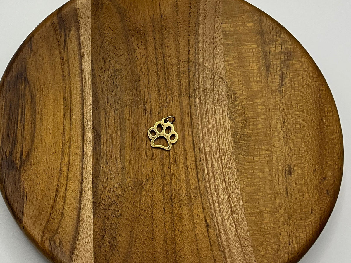 Gold hollow paw print charm