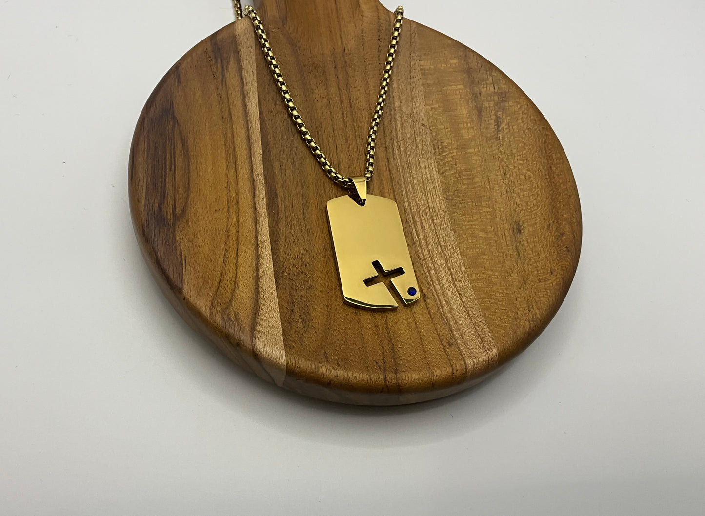 Gold cross dog tag