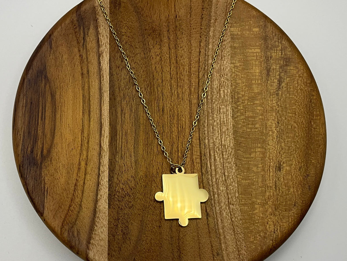 Gold Puzzle Piece Pendant Necklace