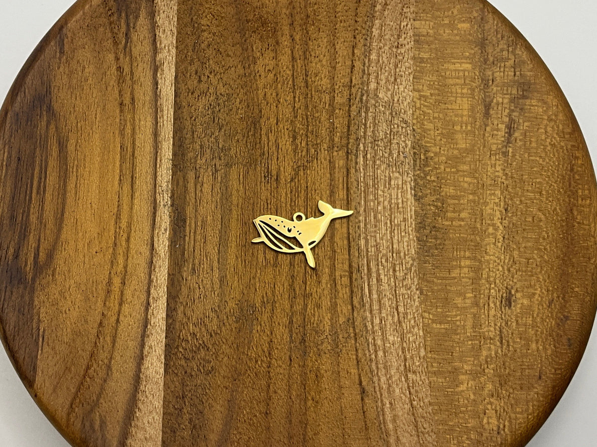 Gold whale charm