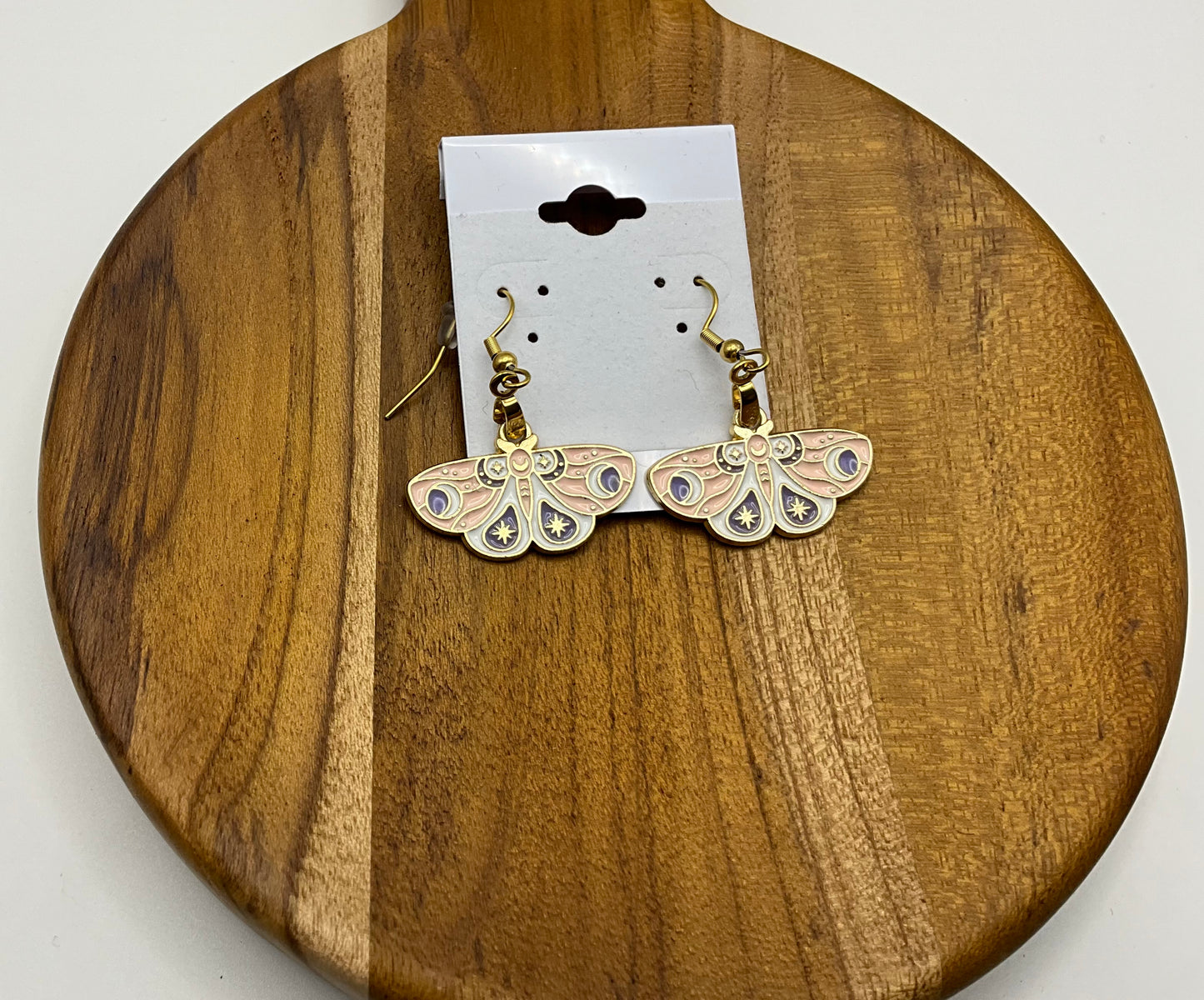 Light pink moth earrings