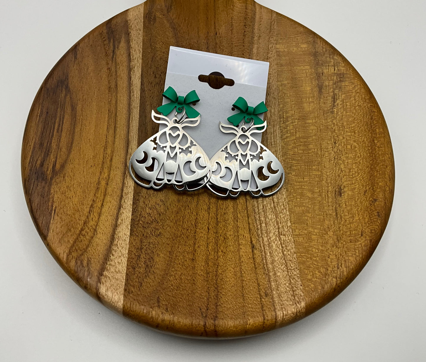 Silver moth earrings green bow