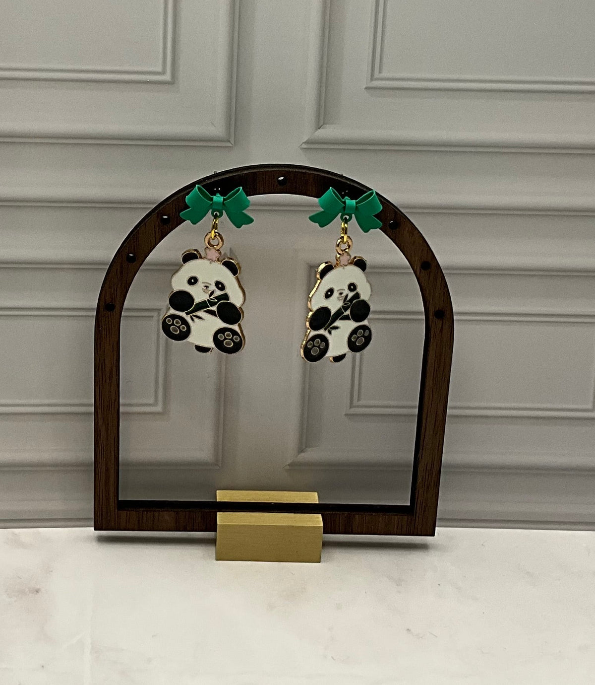 Panda earrings with green bows