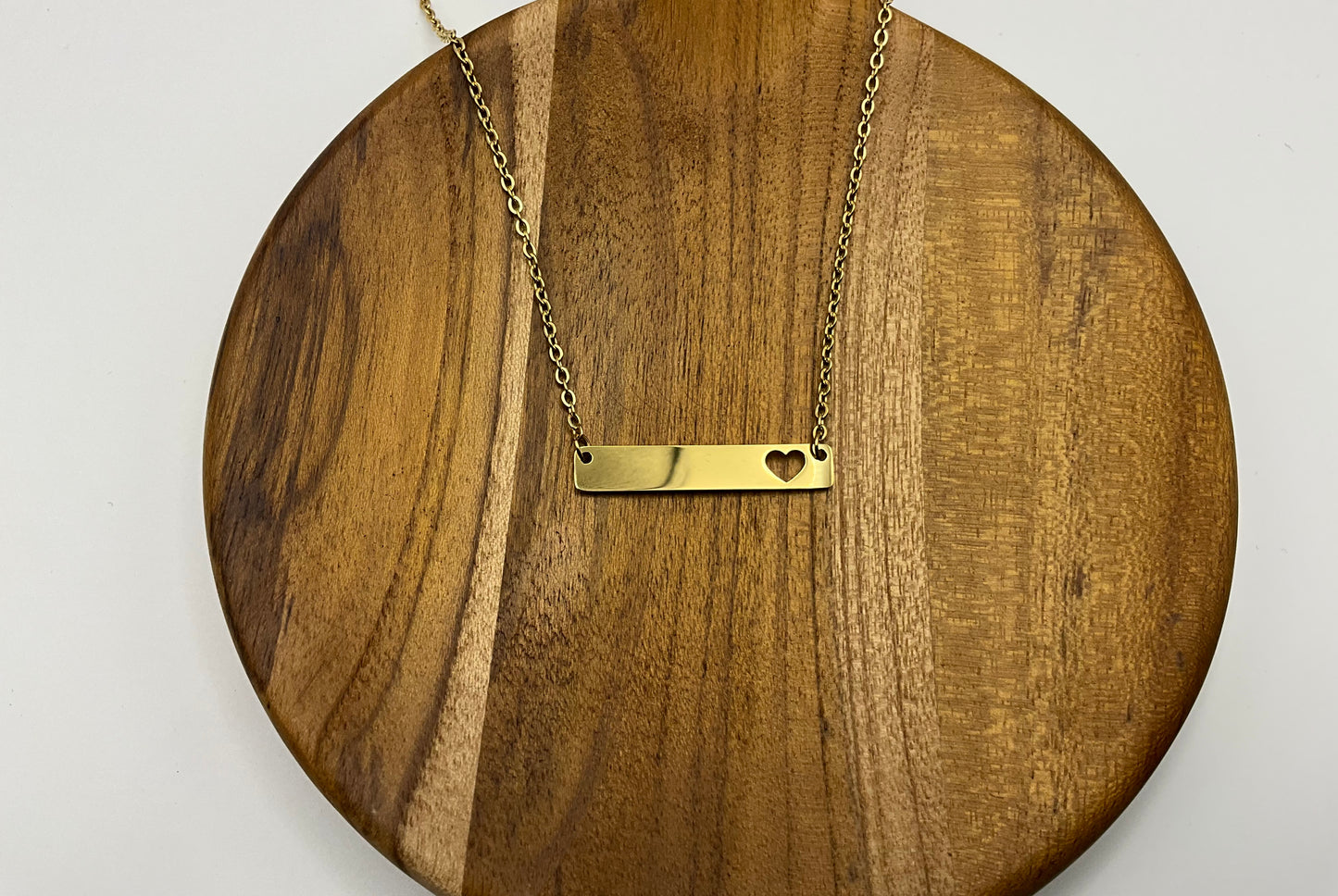 Gold heart cutout horizontal bar