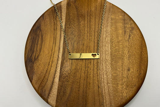 Gold heart cutout horizontal bar